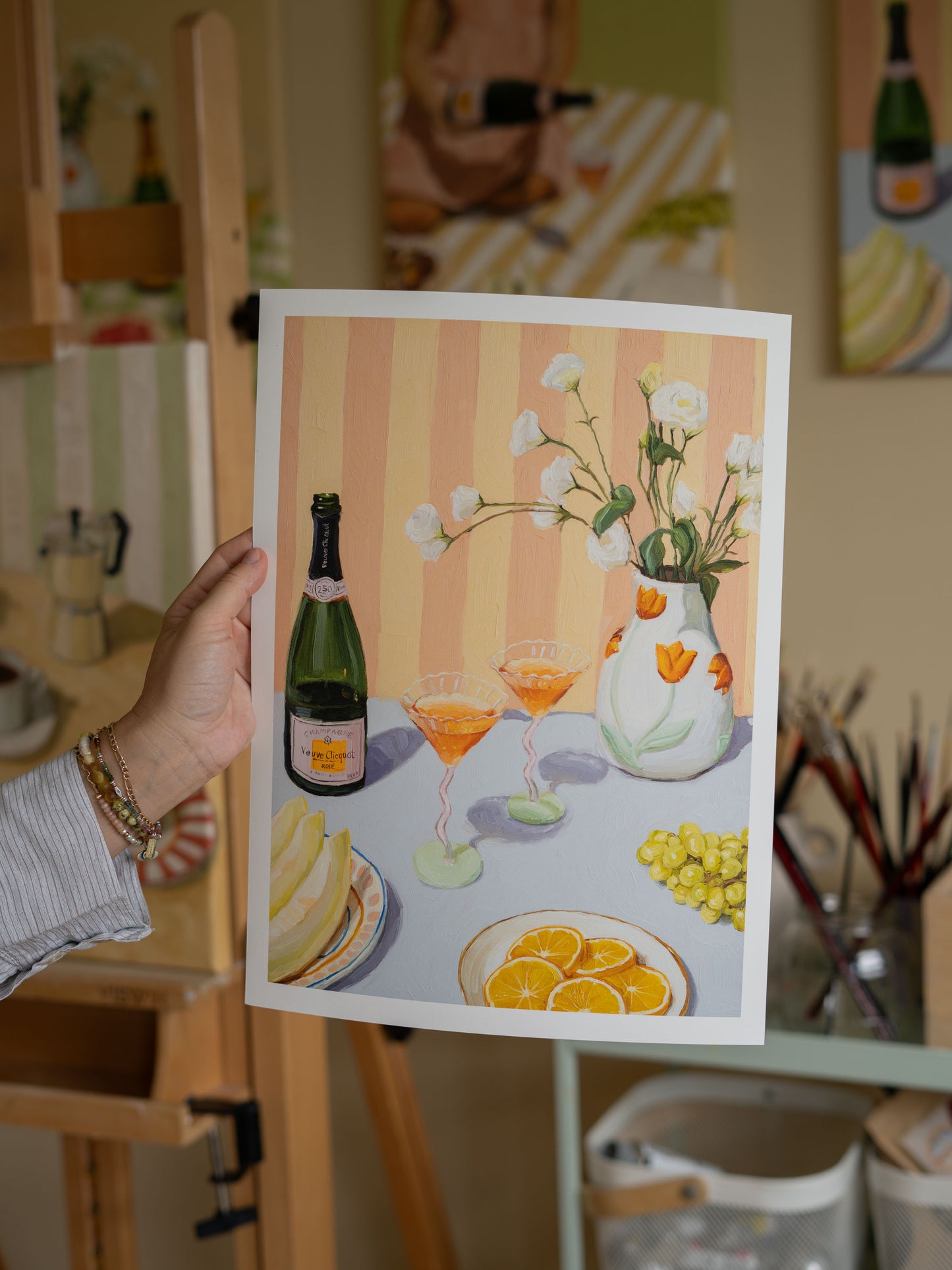 Art print of original oil painting 'Love At First Sip' featuring a still life with champagne, fresh fruits, and flowers. Colorful composition with rich textures, perfect for adding warmth and summer vibes to any room. Hand-signed, open edition print on matte 200 gsm photo paper.