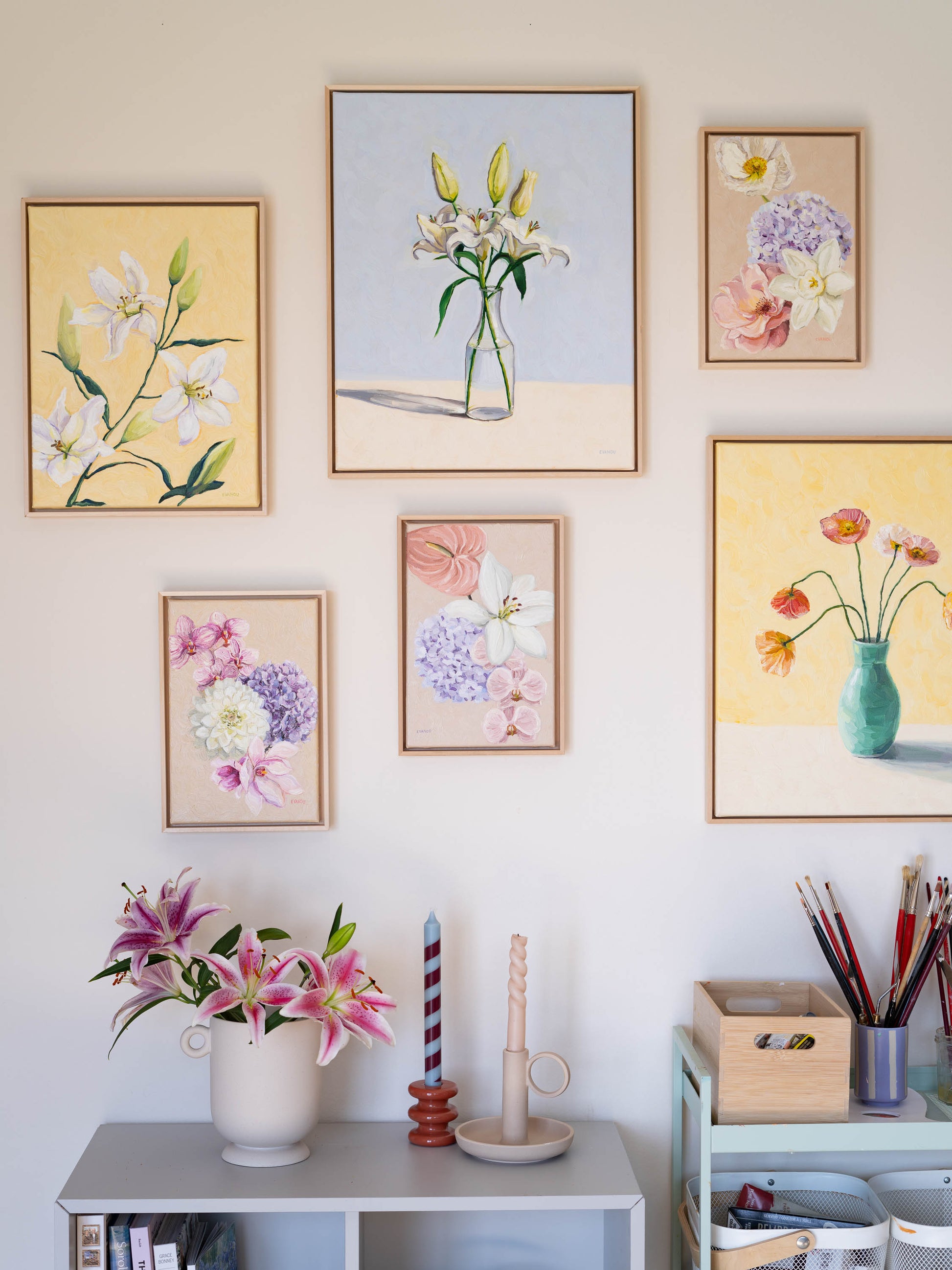 a collection of floral original paintings in pastel colors