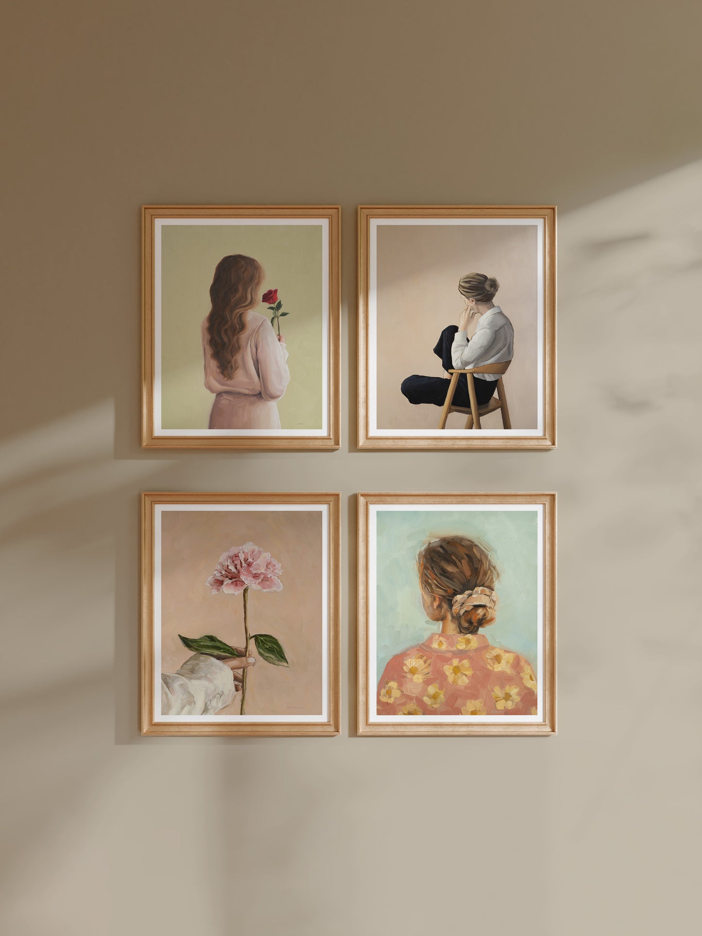 Gallery wall featuring four Evanou Art prints.