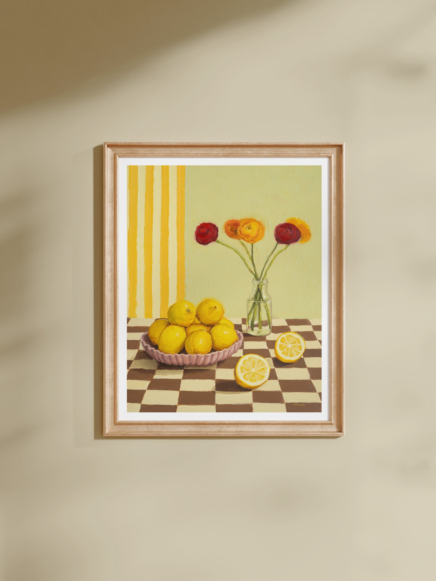 This colourful still life print pictures bright yellow lemons clustered in a ceramic bowl, paired with Ranunculus flowers in a glass vase.