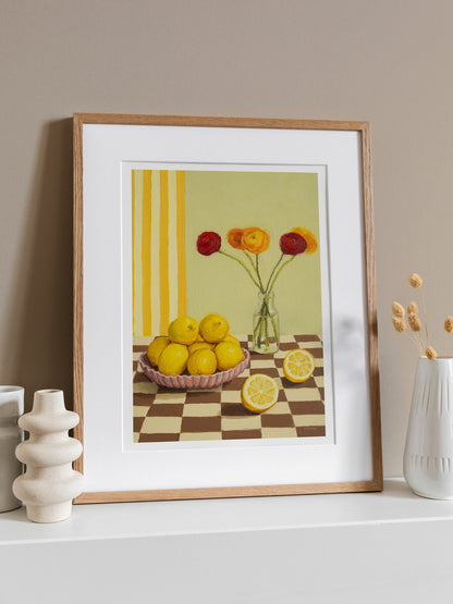 Lemon print. The vertical stripes in the background as well as the checkered tabletop add some playfulness to this scene.