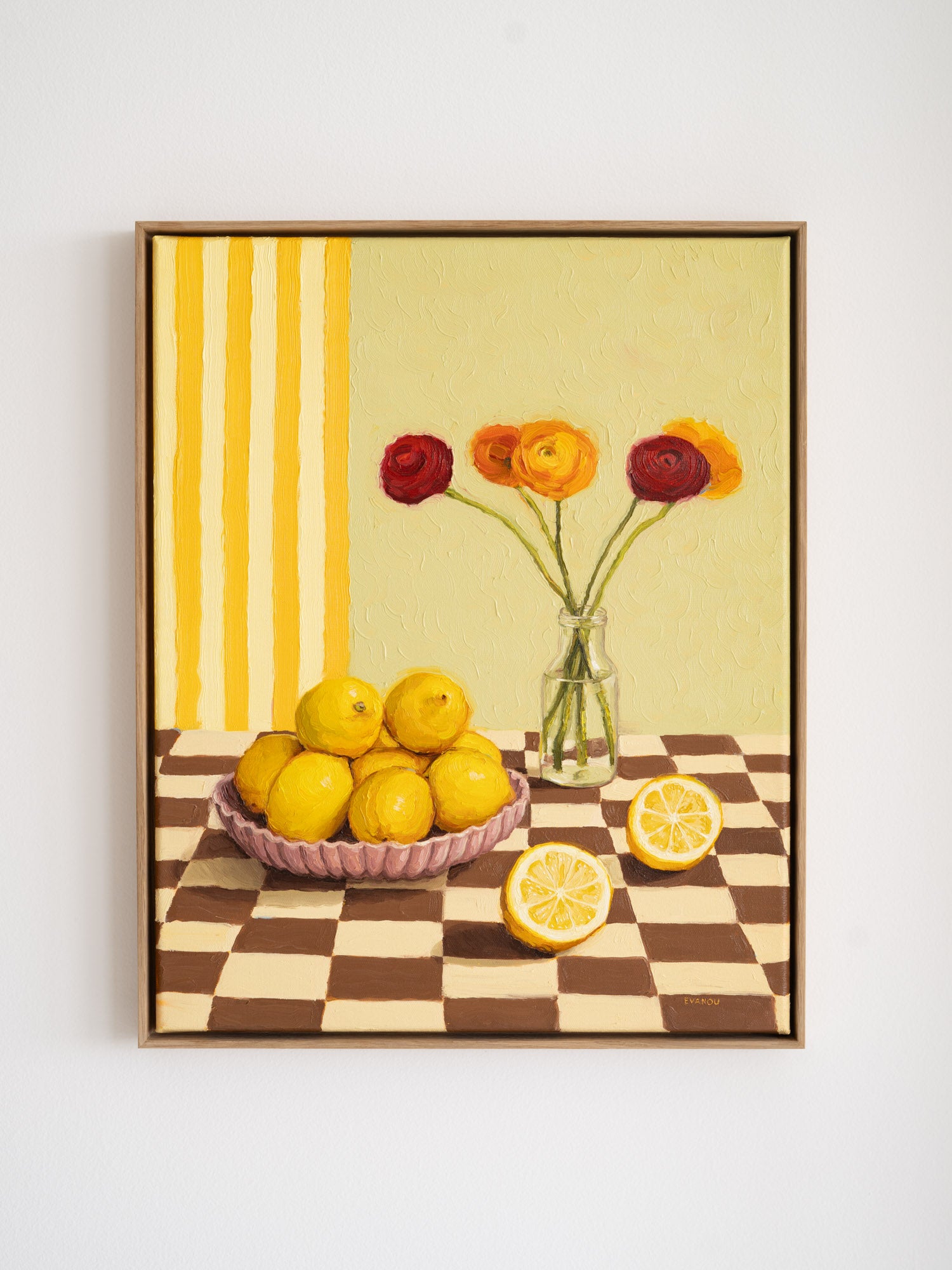 "Lemons and Flowers" is a colourful still life oil painting picturing bright yellow lemons clustered in a ceramic bowl, paired with Ranunculus flowers in a glass vase. The vertical stripes in the background as well as the checkered tabletop add some playfulness to this scene.